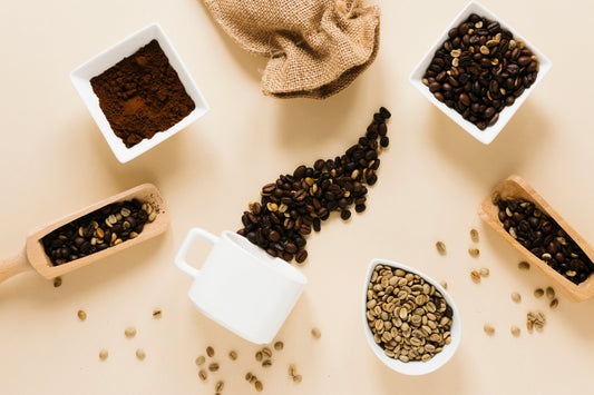 Coffee mug beside ground coffee and whole coffee beans